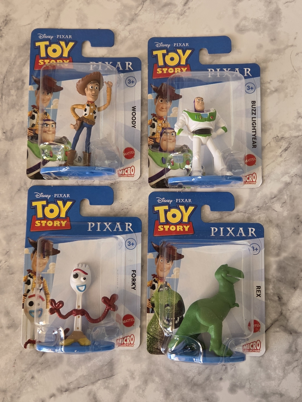 Disney Pixar Toy Story Micro Figures Set of 4 - Blue, White, Green, Yellow, Red